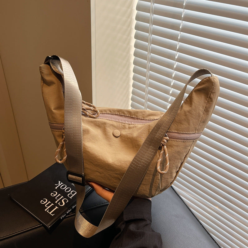 Practical shoulder bag with external zip pockets