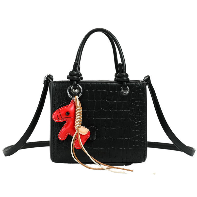 Women's mini bag with animal charm and modern crocodile look