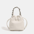 Women's mini backpack bag with elegant chain handle and fine texture