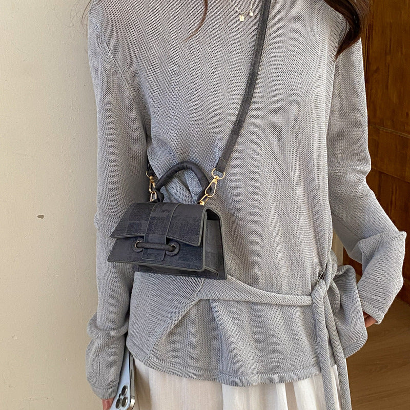 Women's elegant mini handbag with textured design