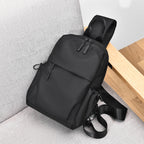 Sling backpack with multiple compartments and ergonomic design