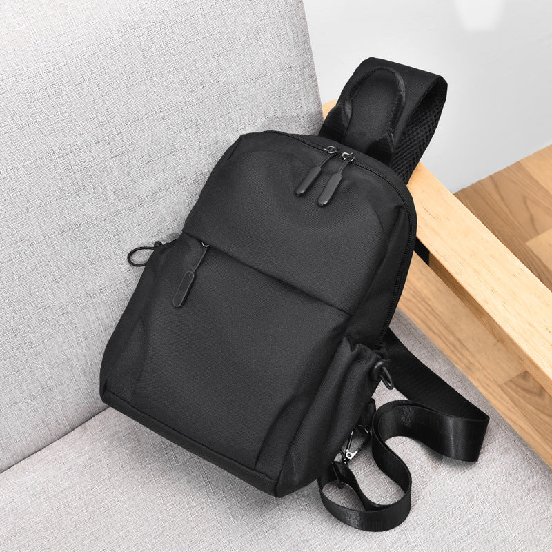 Sling backpack with multiple compartments and ergonomic design