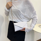 Women's elegant clutch with shiny upper material