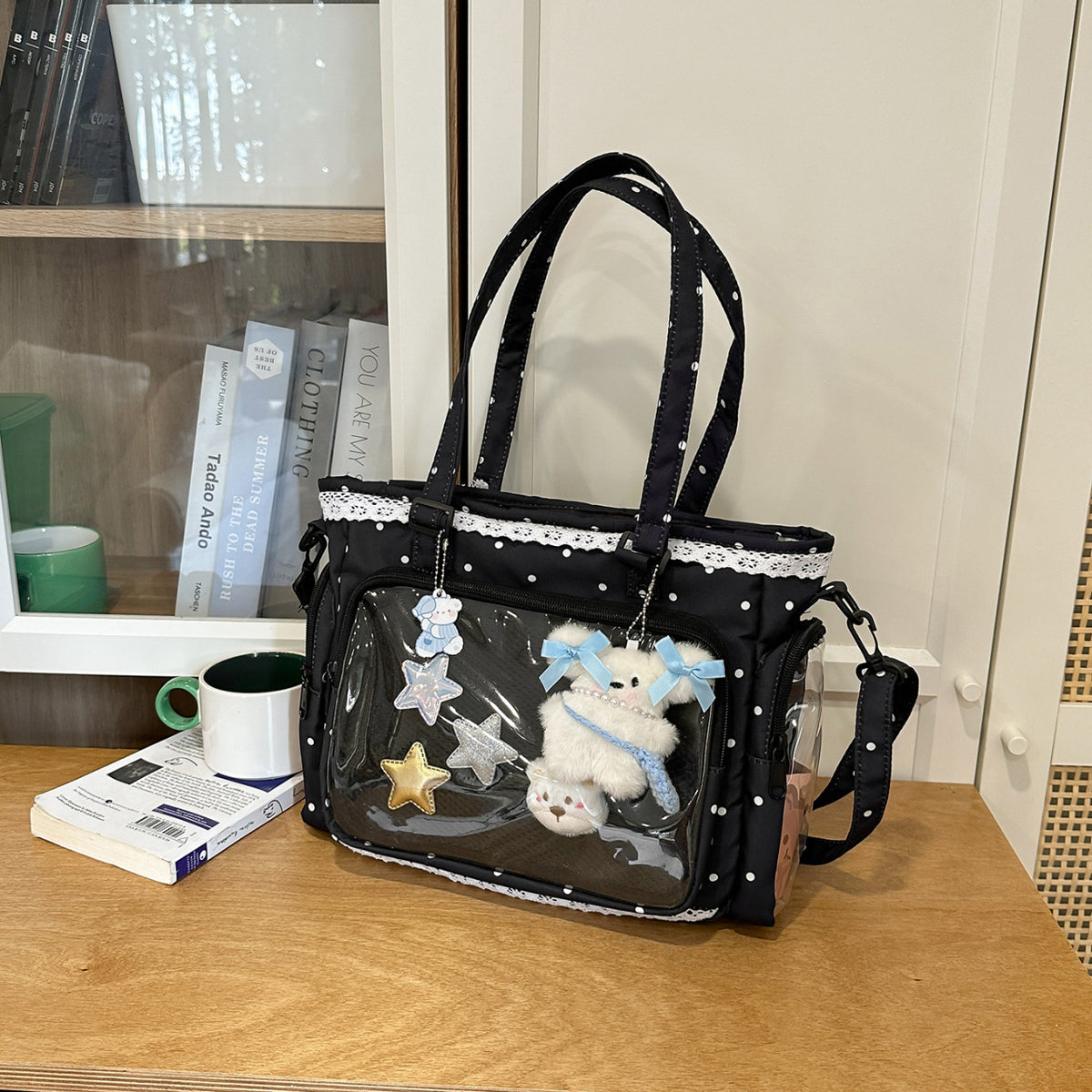 Handbag with Transparent Compartment Division and Playful Application Design