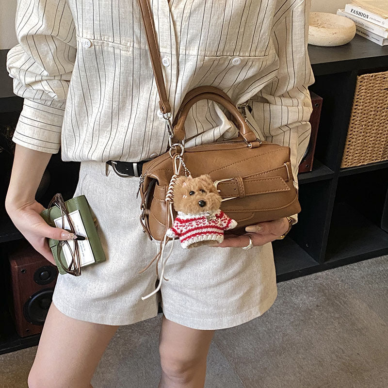 Women's mini handbag with charming animal pendant