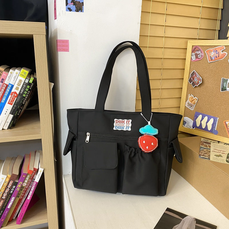 Tote bag with versatile compartments and ergonomic design
