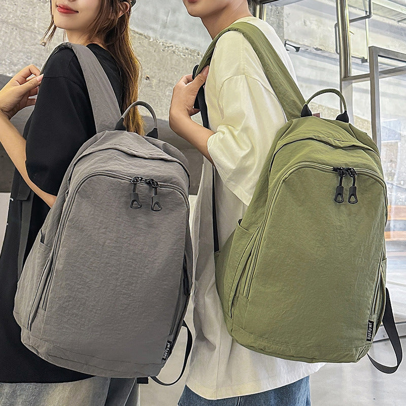 City backpack with versatile compartments and breathable carrying system
