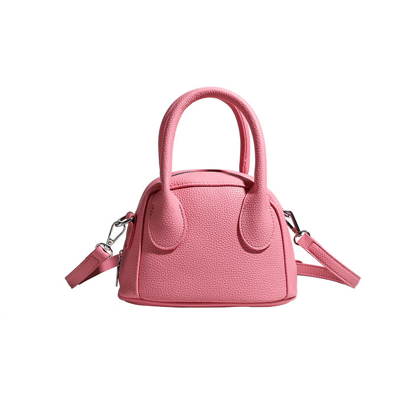 Women's mini handbag with structured exterior and detachable shoulder strap