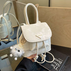 Women's mini backpack with playful design and plush pendant