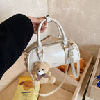 Women's mini handbag with playful teddy pendant