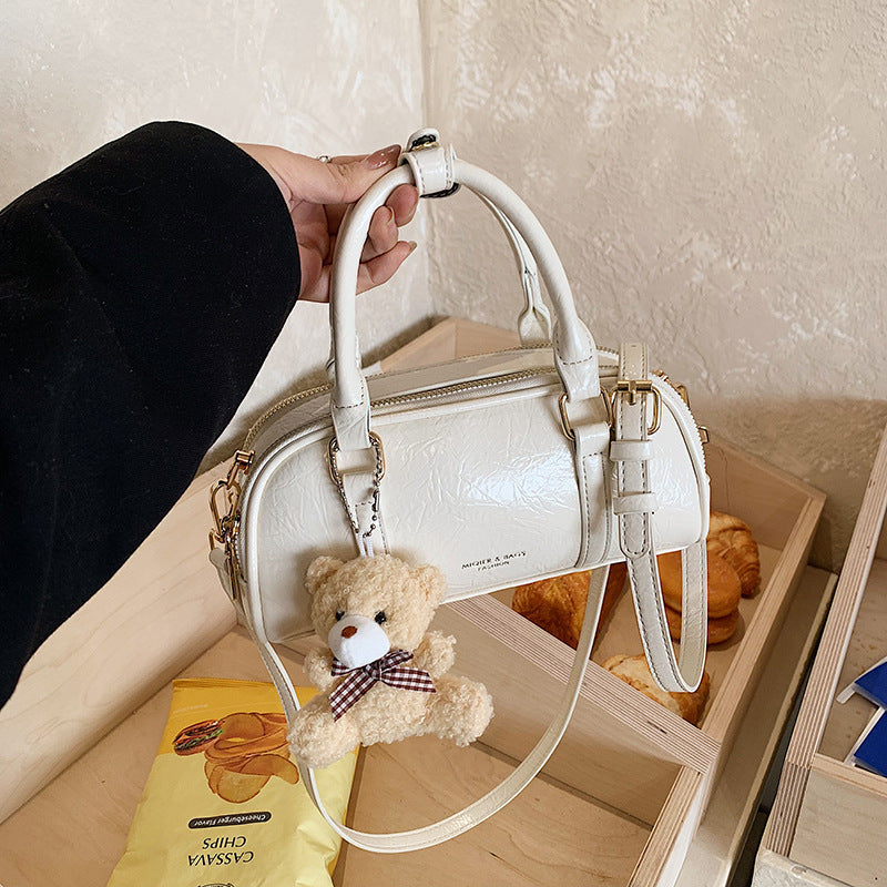 Women's mini handbag with playful teddy pendant