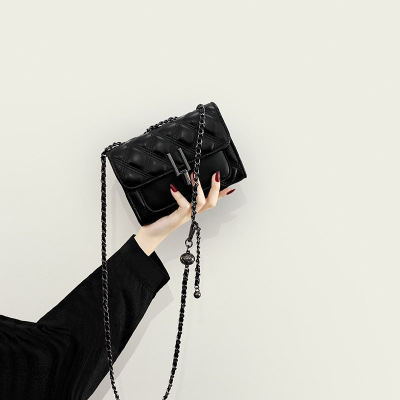 Women’s mini clutch with elegant chain strap and luxurious quilted pattern