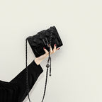 Women’s mini clutch with elegant chain strap and luxurious quilted pattern