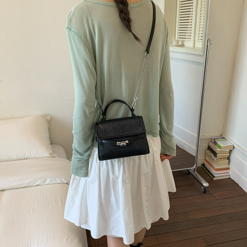 Ladies fashionable mini handbag with decorative magnetic closure