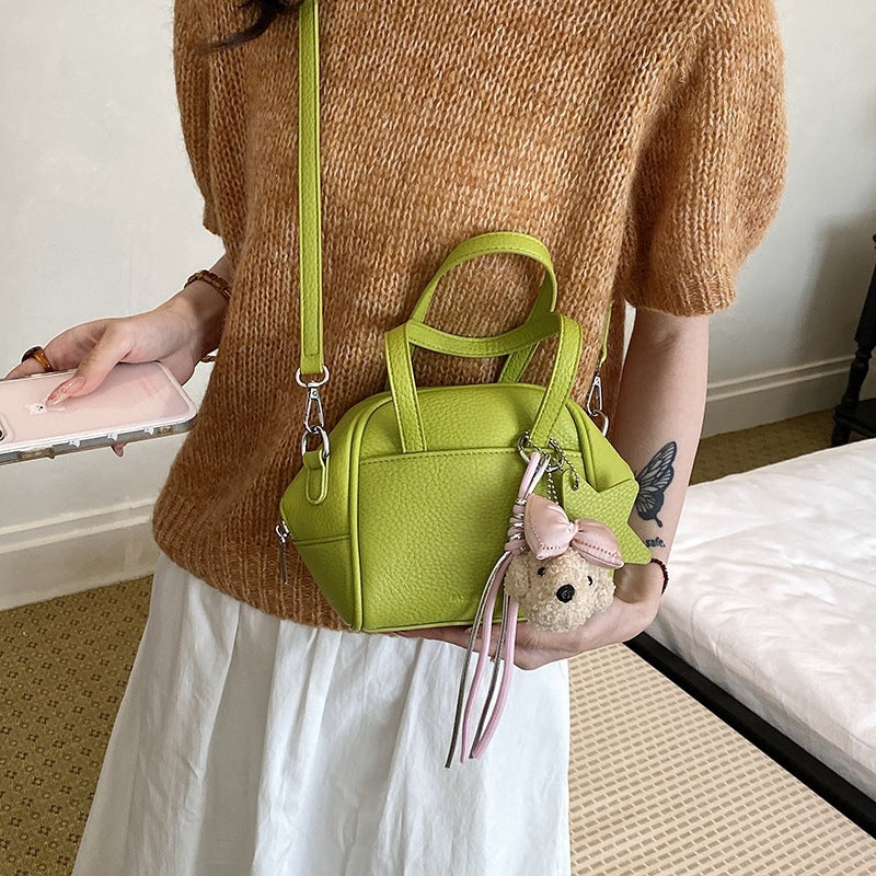 Ladies mini bag with decorative pendant