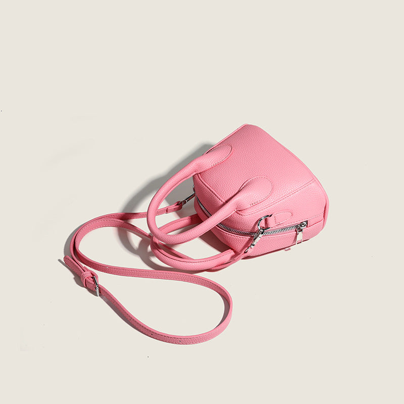 Women's mini handbag with structured exterior and detachable shoulder strap