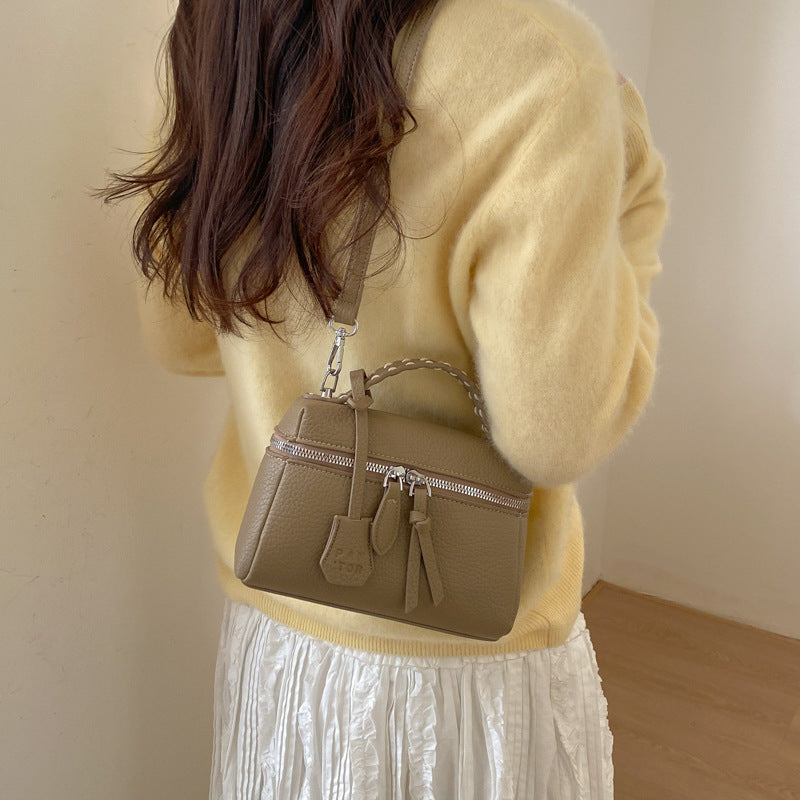 Women's mini handbag with fine decorative seams and detachable shoulder strap
