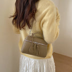 Women's mini handbag with fine decorative seams and detachable shoulder strap