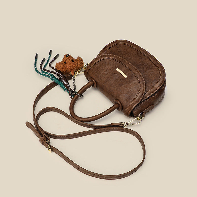 Women's mini handbag with playful detail and high-quality faux leather