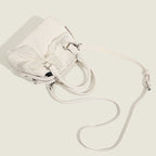 Women’s mini handbag with playful bow accent