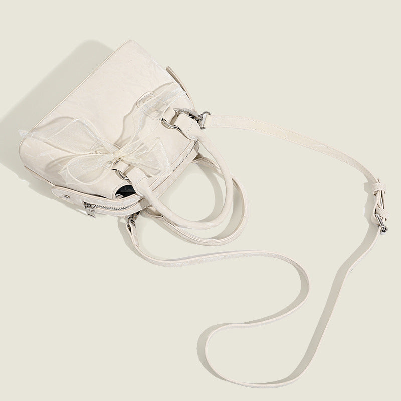 Women’s mini handbag with playful bow accent