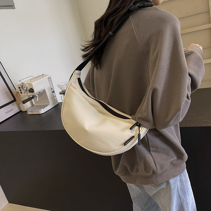 Shoulder bag with adjustable strap and multiple compartments