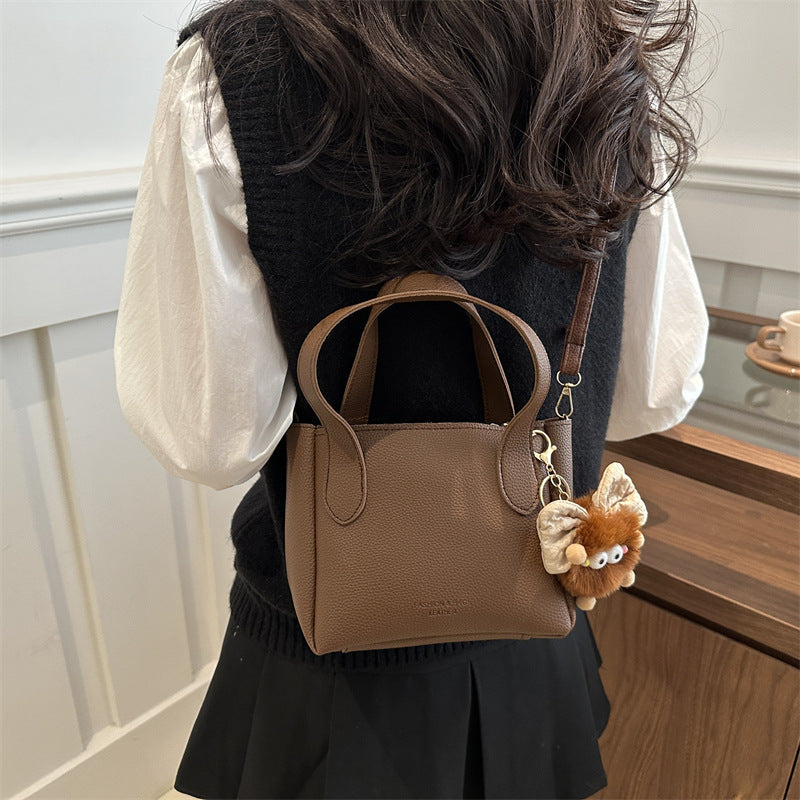 Women’s mini bag with playful animal pendant