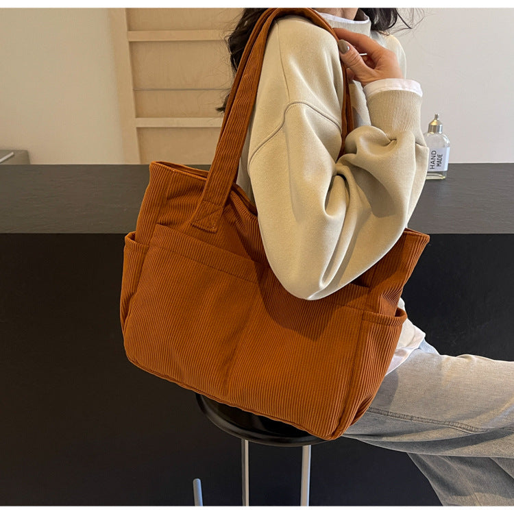 Multifunctional shoulder bag with large outer pockets