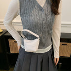 Women's mini handbag with shiny chain and textured upper material