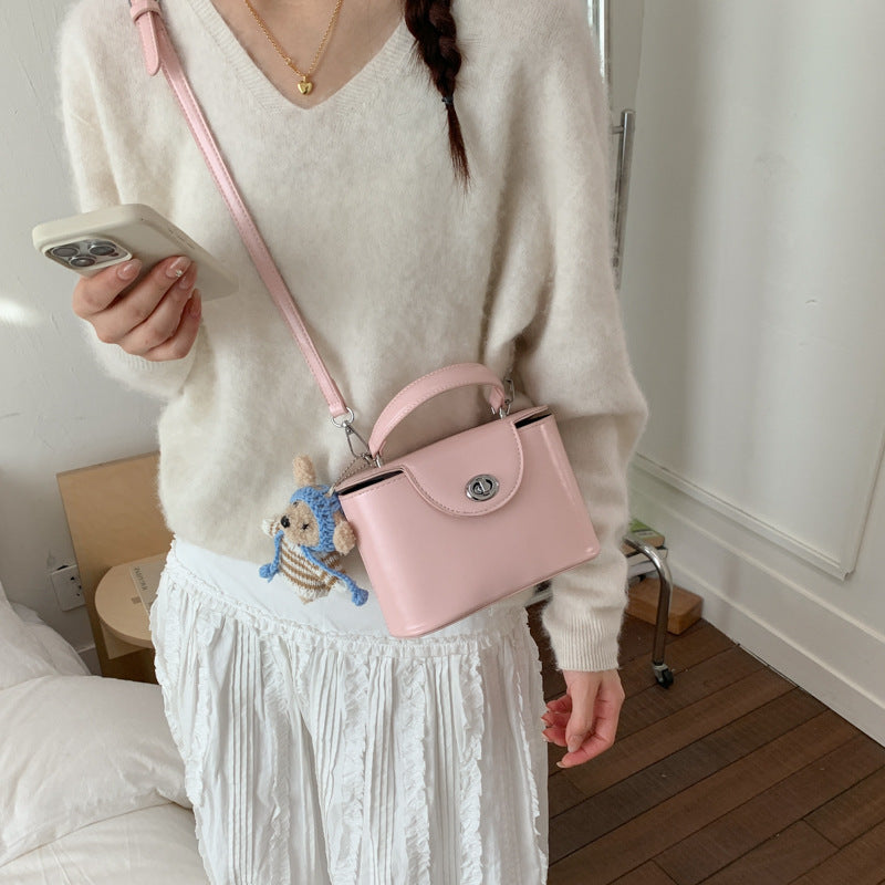 Women’s mini handbag with cute animal pendant