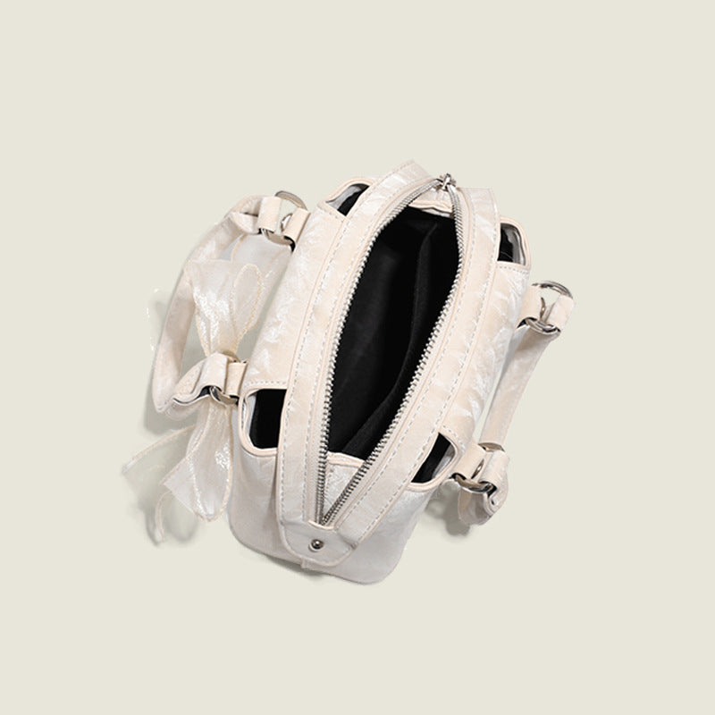 Women’s mini handbag with playful bow accent