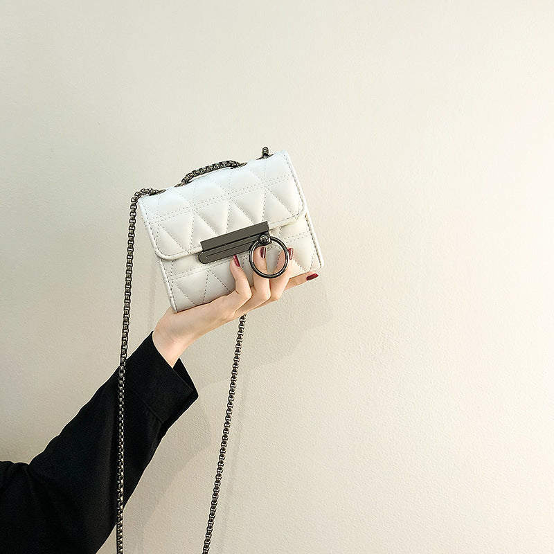 Women's clutch bag with elegant quilting and fine chain strap