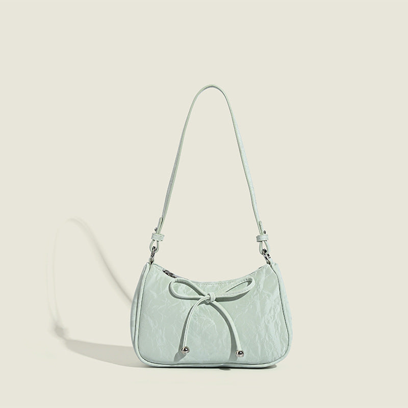 Ladies elegant mini handbag with playful drawstring
