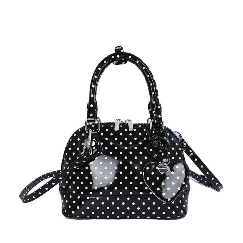Women’s mini handbag with playful polka dot pattern and detachable shoulder strap