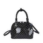 Women’s mini handbag with playful polka dot pattern and detachable shoulder strap