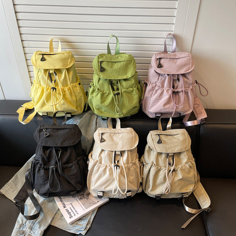 Leisure backpack with elastic drawstring and practical side pockets