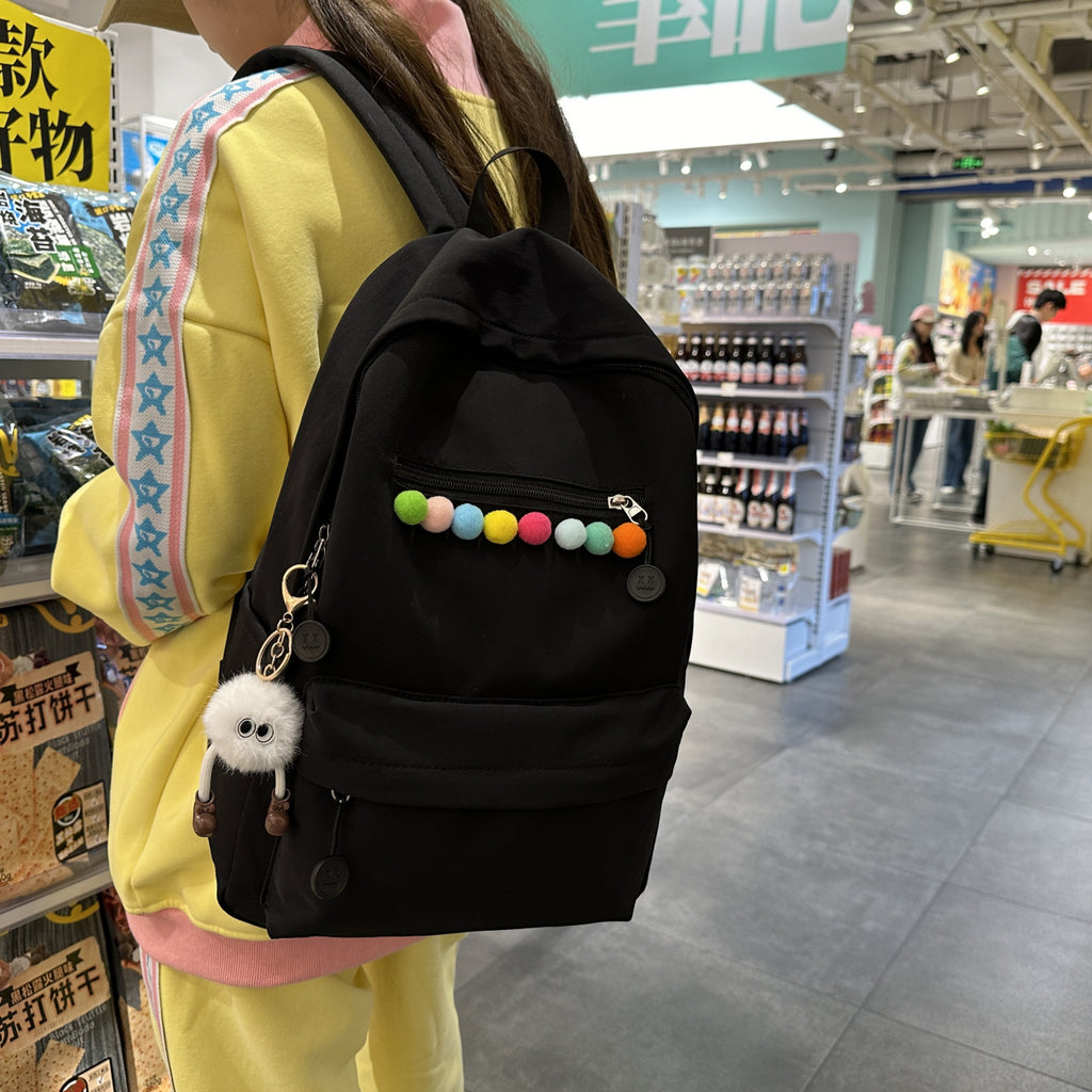 Practical backpack with colorful applications
