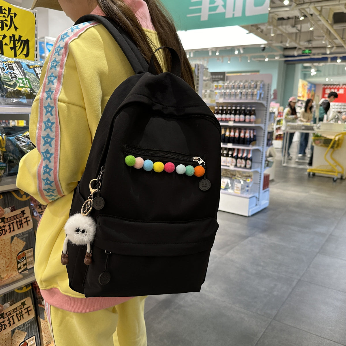 Practical backpack with colorful applications