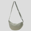 Shoulder bag with practical compartment system and adjustable shoulder strap