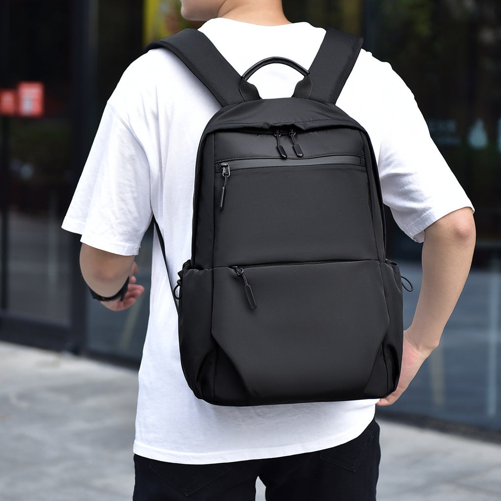 Practical city backpack with multiple compartments and waterproof material