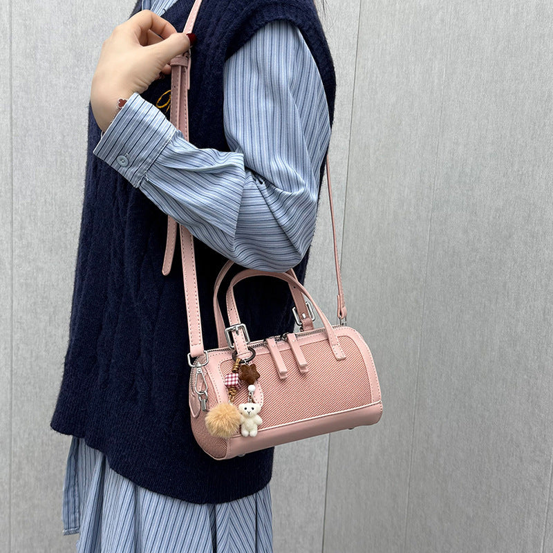 Women's mini bag with playful charm