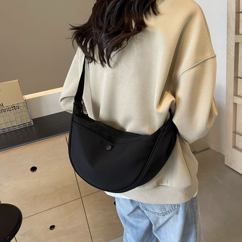 Shoulder bag with adjustable strap and multiple compartments