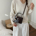 Women’s mini handbag with cute animal pendant