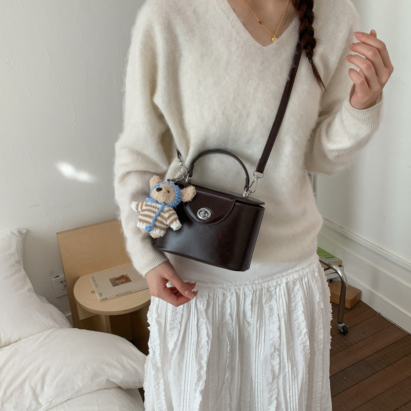 Women’s mini handbag with cute animal pendant