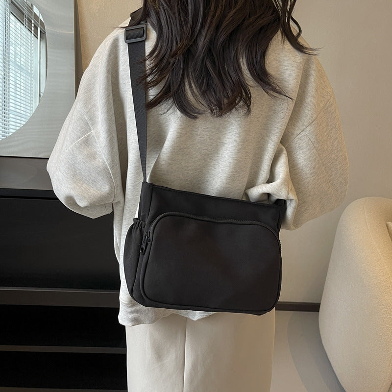 Practical shoulder bag with versatile storage compartments
