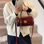 Women's elegant handbag with golden accents