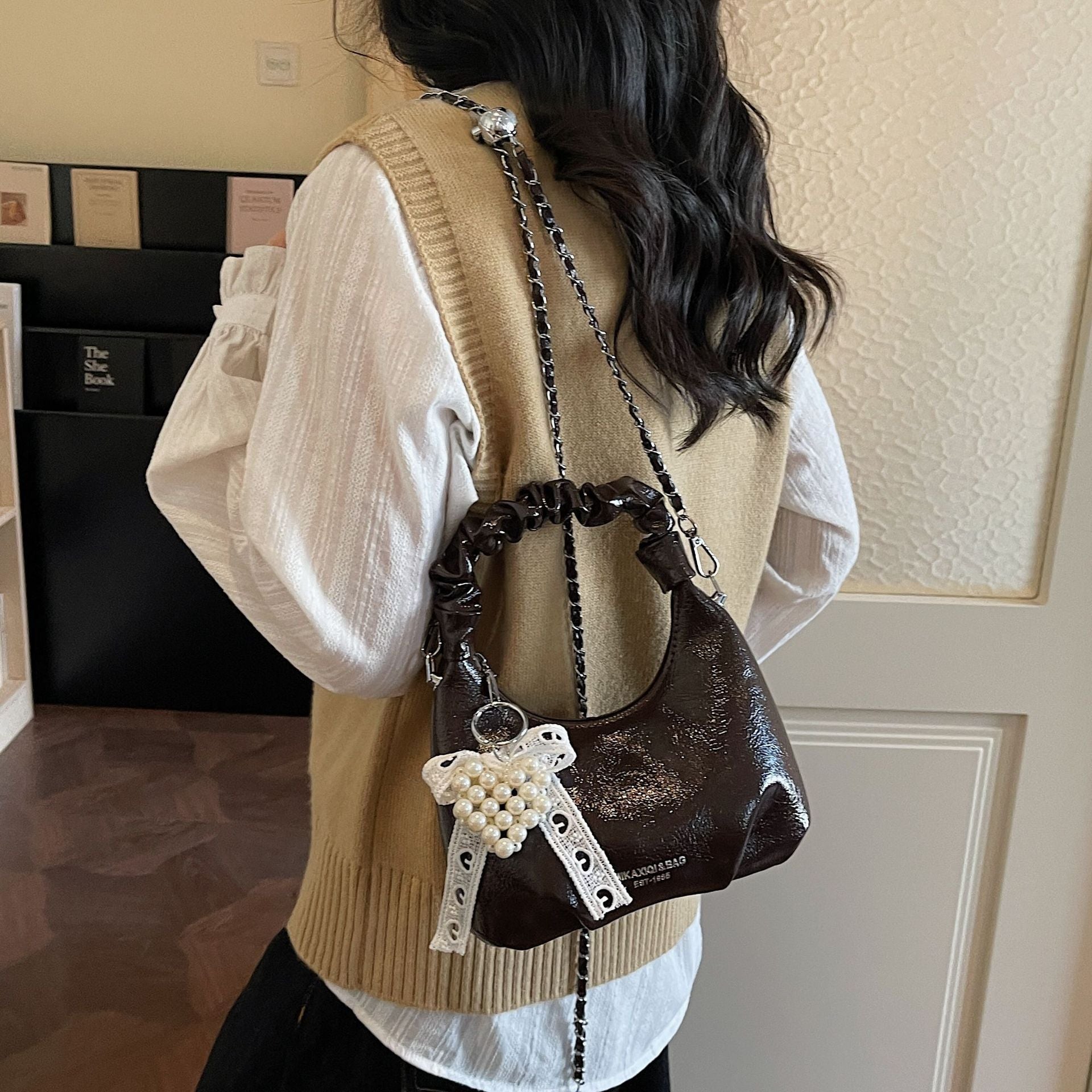 Ladies mini handbag with voluminous ruffle design and trendy charms