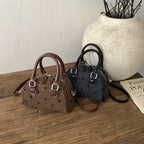 Women’s mini handbag made of high-quality material with a textured surface