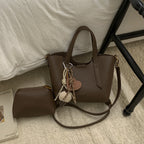Women's mini handbag in an elegant design with charming pendant