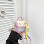 Women's mini handbag with cheerful cherry design and charming pendants